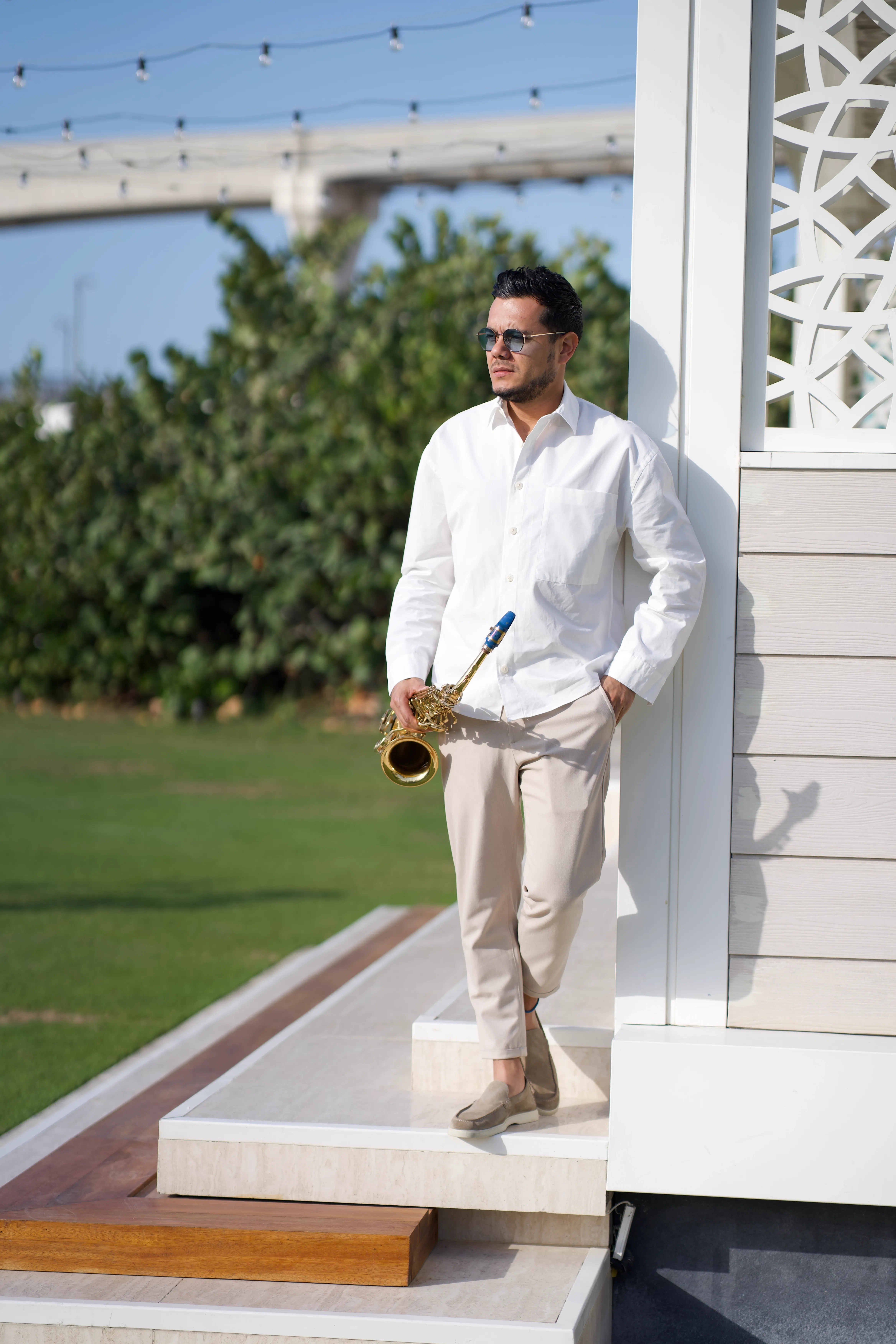 Manu performing in a garden